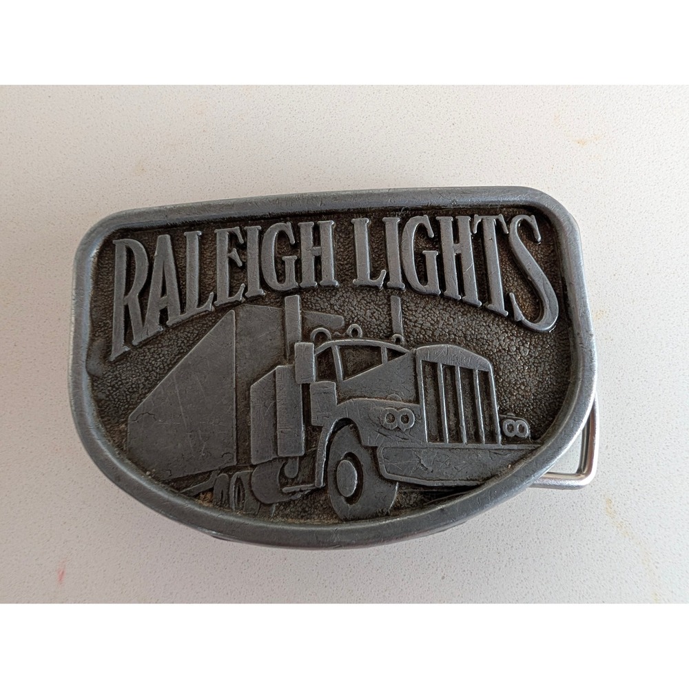 Vintage Raleigh Lights Semi Truck Belt Buckle Pewter Tone Tobacco Promo Big Rig